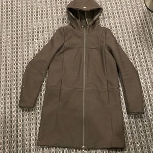 All season hooded unlined water resistant knee length. Dual zipper slash pockets